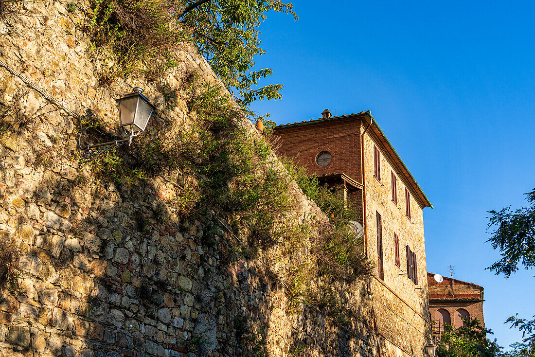 Part of the 12th century city walls of Chiusdino, Tuscany, Italy