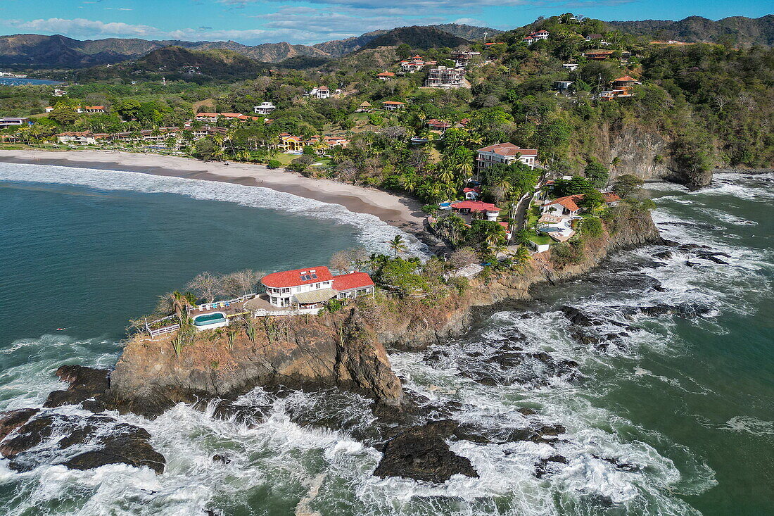 Aerial view of villas on headland with Flamingo Beach behind, Playa Flamingo, Guanacaste, Costa Rica, Central America