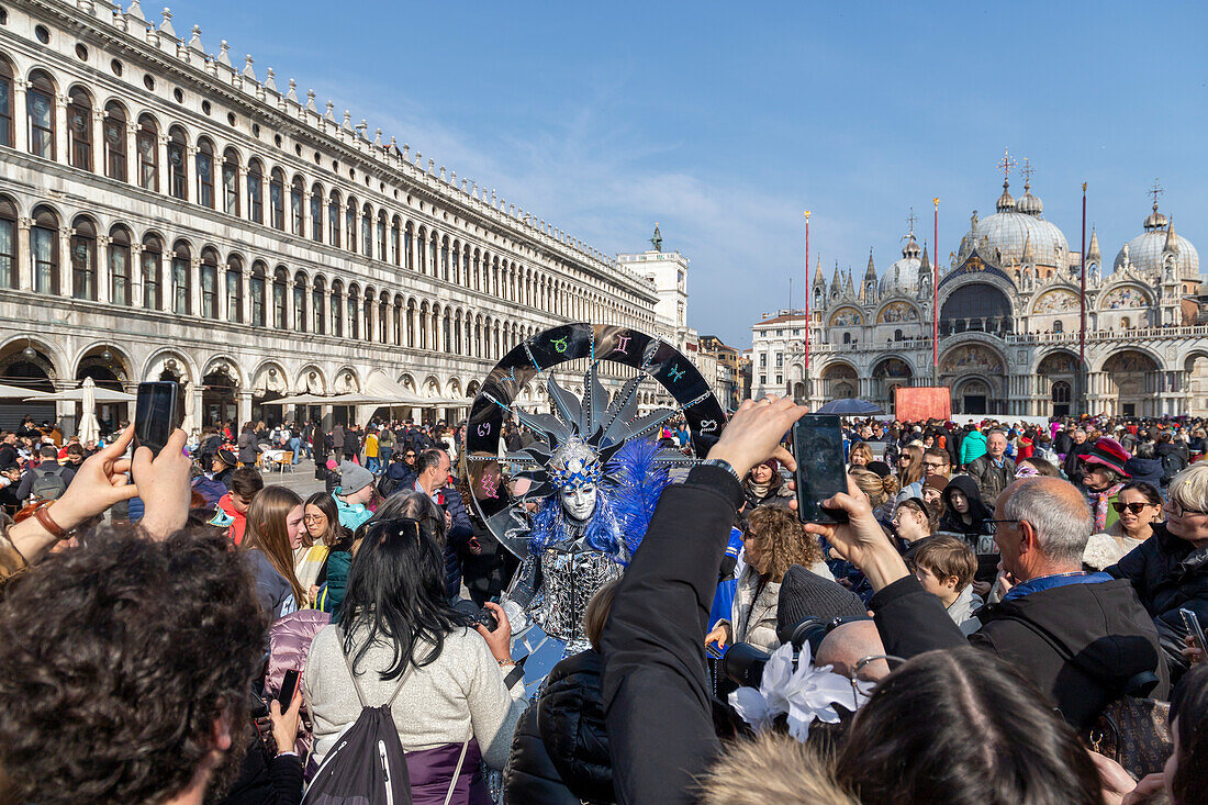 Tourists are photographing character in carnival costumes.. Venice, Veneto, Italia