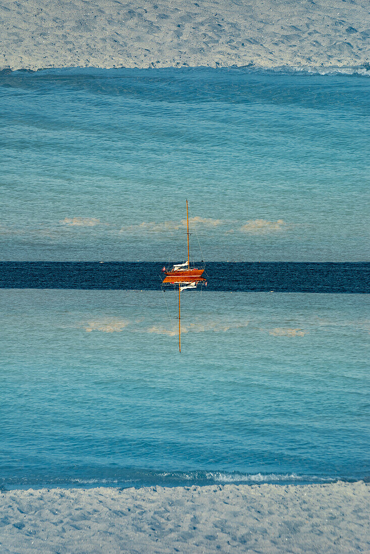 Double exposure of a sailboat as seen from the Kilometerbroen bridge in Copenhagen, Denmark.