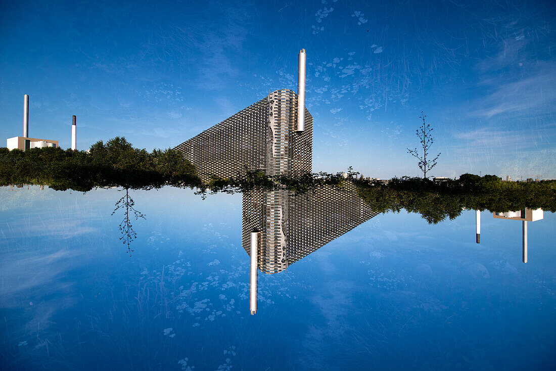 Double exposure of Copenhill, a waste to energy plant that houses a ski slope, climbing hill and walking trails.
