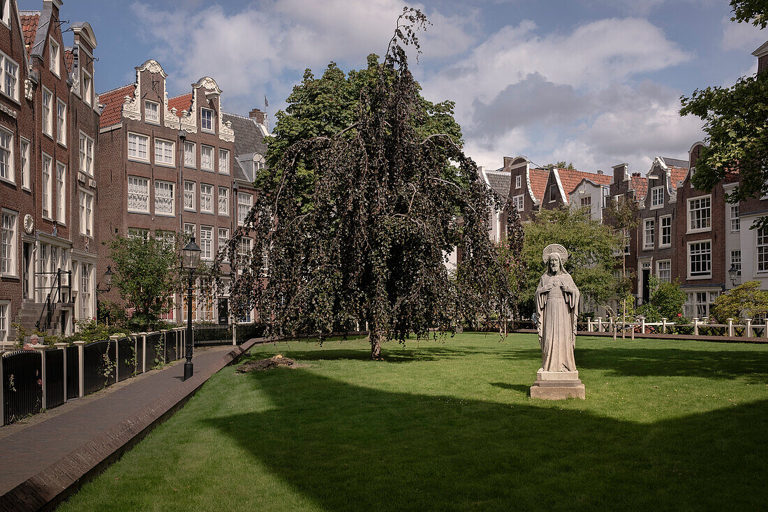 Courtyard with statue and typical architecture, Amsterdam, province of North Holland, The Netherlands, Europe