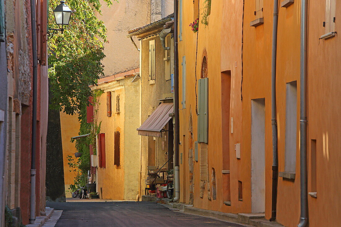 Facades painted with ocher in Flassan, Vaucluse, Provence-Alpes-Côte d'Azur, France