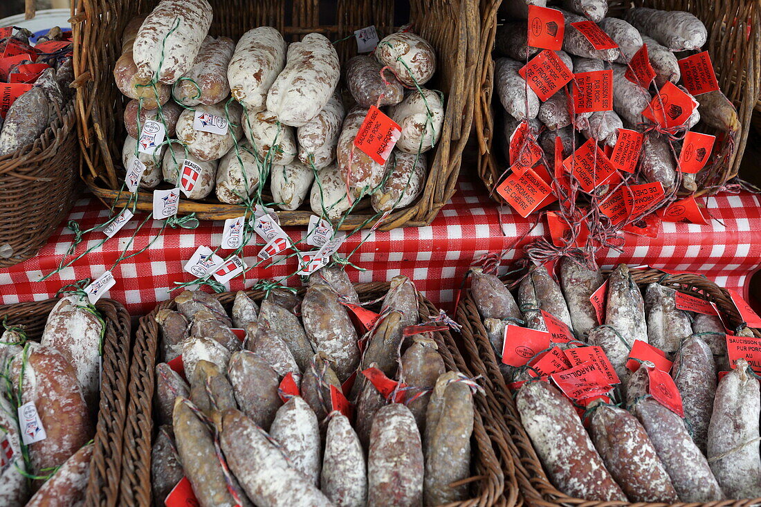 Stall selling dried sausages at the Marché de la vieille ville, Annecy, Haute-Savoie, Auvergne-Rhone-Alpes, France