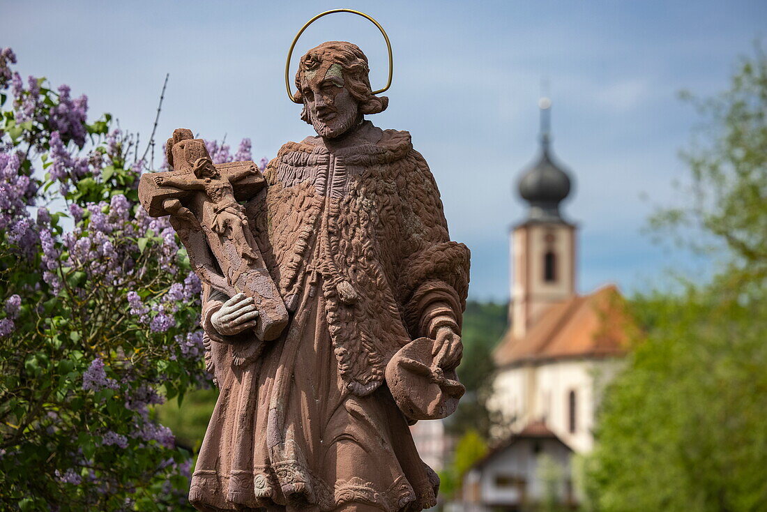 Statue with church tower behind, Tauberbischofsheim Dittigheim, Franconia, Baden-Wuerttemberg, Germany, Europe