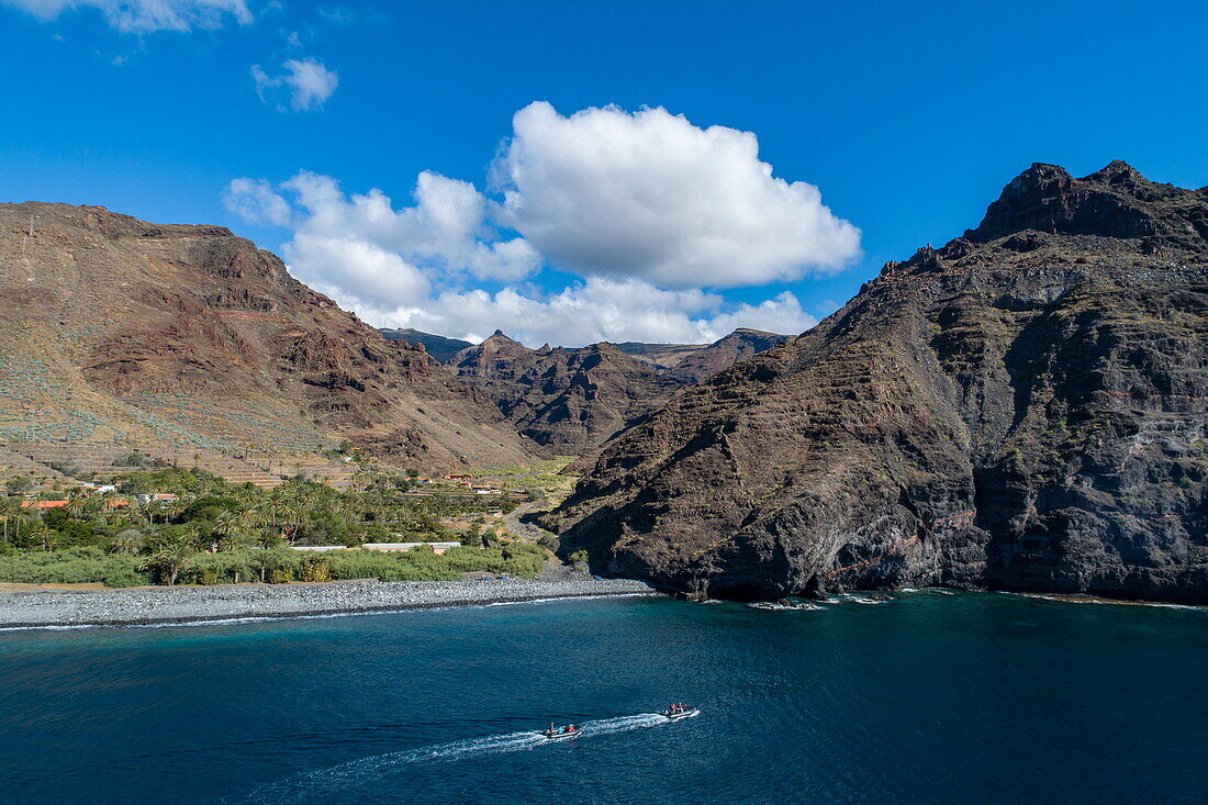 Aerial view of Zodiac inflatable boat excursion from expedition cruise ship World Voyager (nicko cruises) along the coast, near San Sebastián de La Gomera, La Gomera, Canary Islands, Spain, Europe