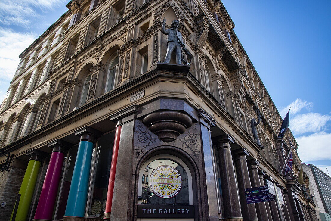 John Lennon statue on the ledge of the Hard Days Night Hotel on Mathew Street, Liverpool, England, United Kingdom, Europe