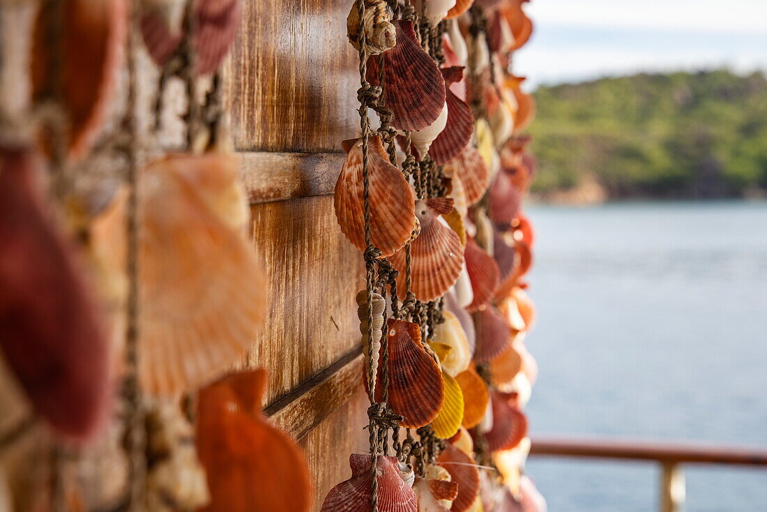 Strings of shells are used as decoration aboard boutique cruise ship M/Y Pegasos (Variety Cruises), Curieuse Island, Seychelles, Indian Ocean