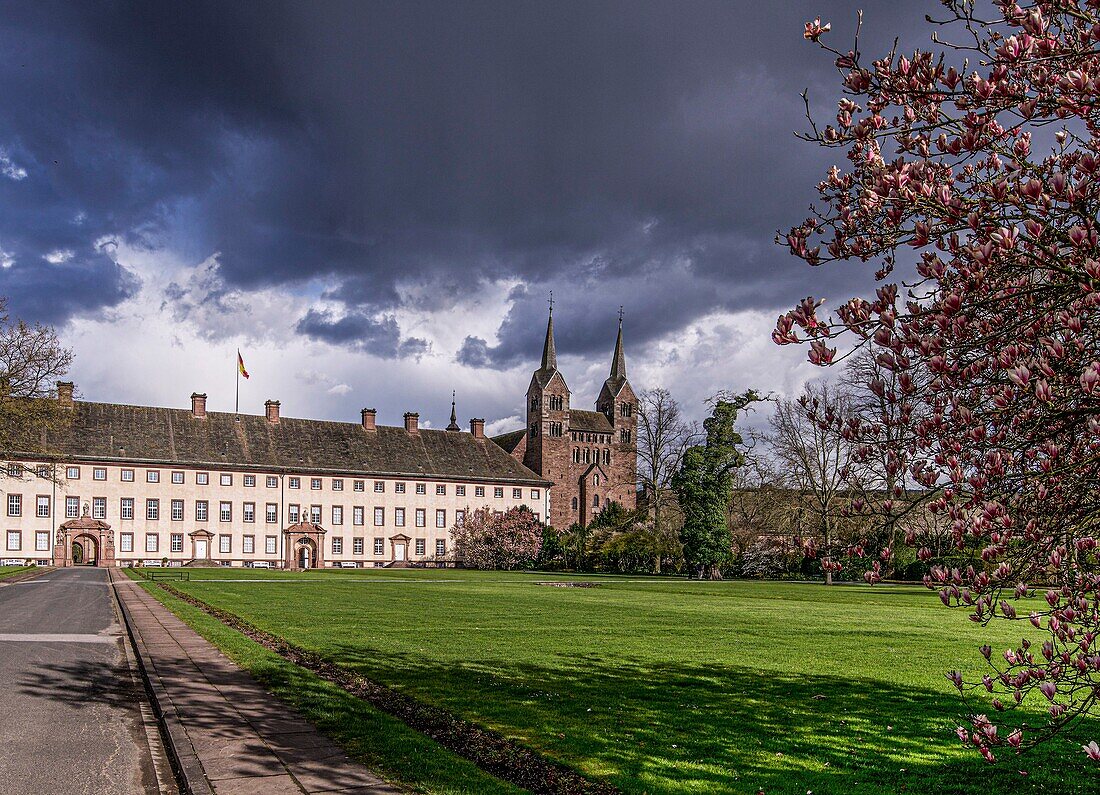 Corvey Castle and the abbey's westwork under a dramatic cloudy sky, Höxter, Weser Uplands, North Rhine-Westphalia, Germany