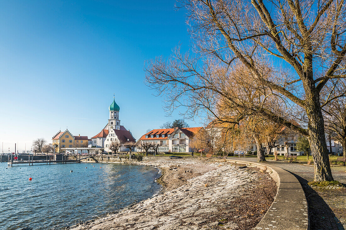 Waterfront promenade with Church of St. Georg, Wasserburg am Bodensee, Bavaria, Germany
