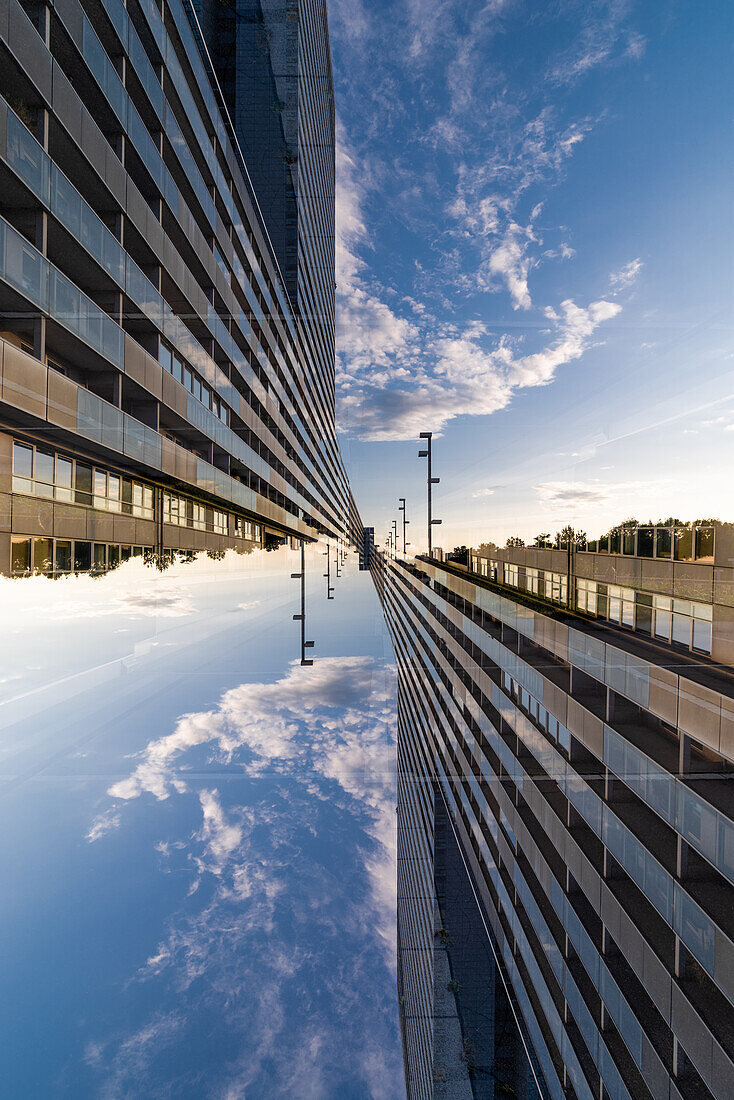 Double exposure of a modern housing complex on the left bank of the river Donau in Viennna, Austria, as seen from the Leonard Bernstein Street.