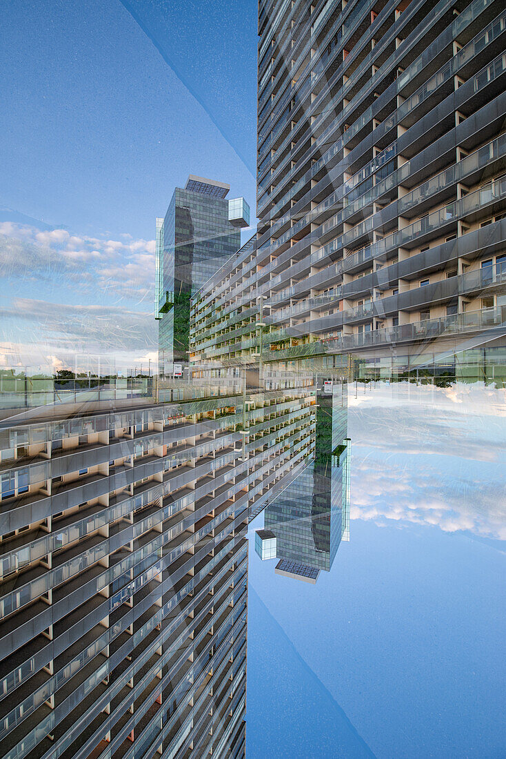Double exposure of a modern housing complex on the left bank of the river Donau in Viennna, Austria, as seen from the Leonard Bernstein Street.