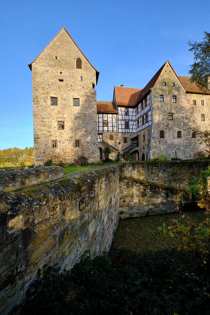 Moated castle Brennhausen near the Reutsee near Sulzdorf at the Lederhecke, Rhön-Grabfeld district, Lower Franconia, Bavaria, Germany