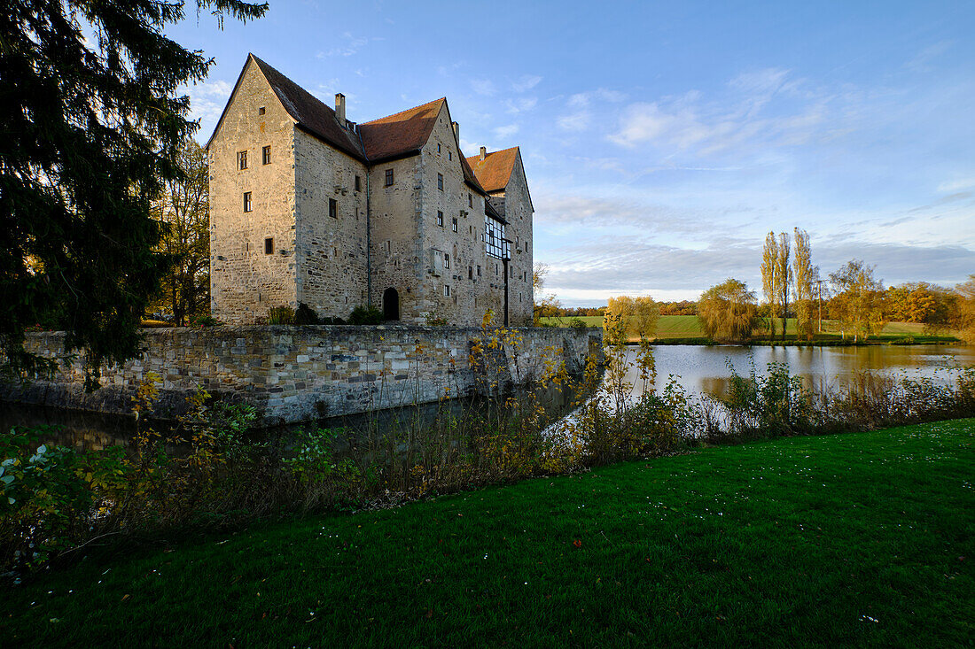 Moated castle Brennhausen near the Reutsee near Sulzdorf at the Lederhecke, Rhön-Grabfeld district, Lower Franconia, Bavaria, Germany