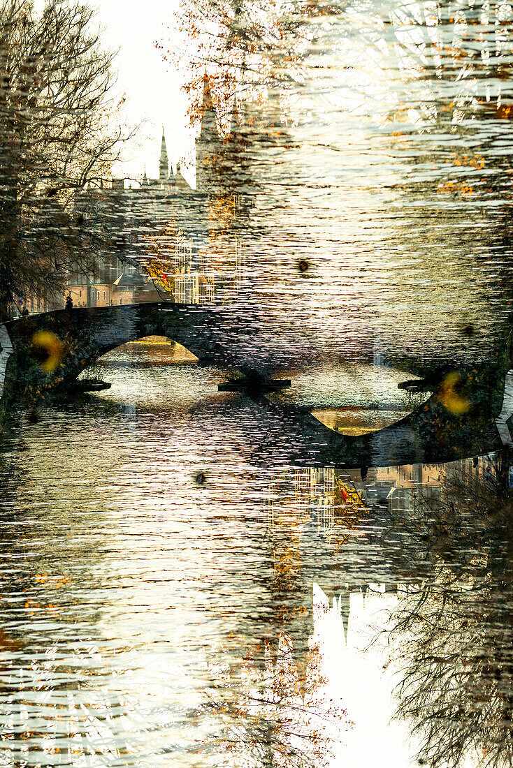 Double exposure of one of Bruges' medieval stone bridges over it's city canals.