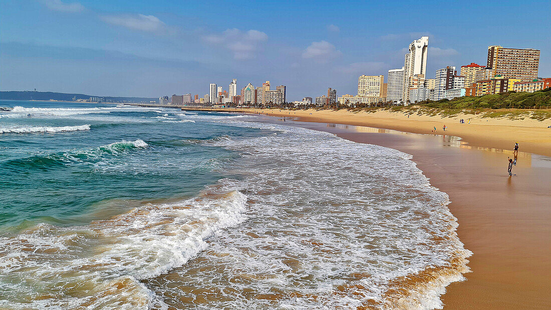 Sandy beach and silhouette of Durban, Durban, South Africa