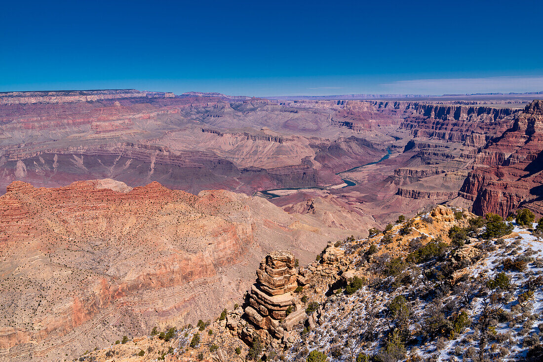 The Grand Canyon as seen from the South Rim in Arizona. The large gorge was eroded over millions of years by weather and the Colorado river that still runs through it. The reddish tint it has is due to the iron contained in the rock's minerals that oxide.