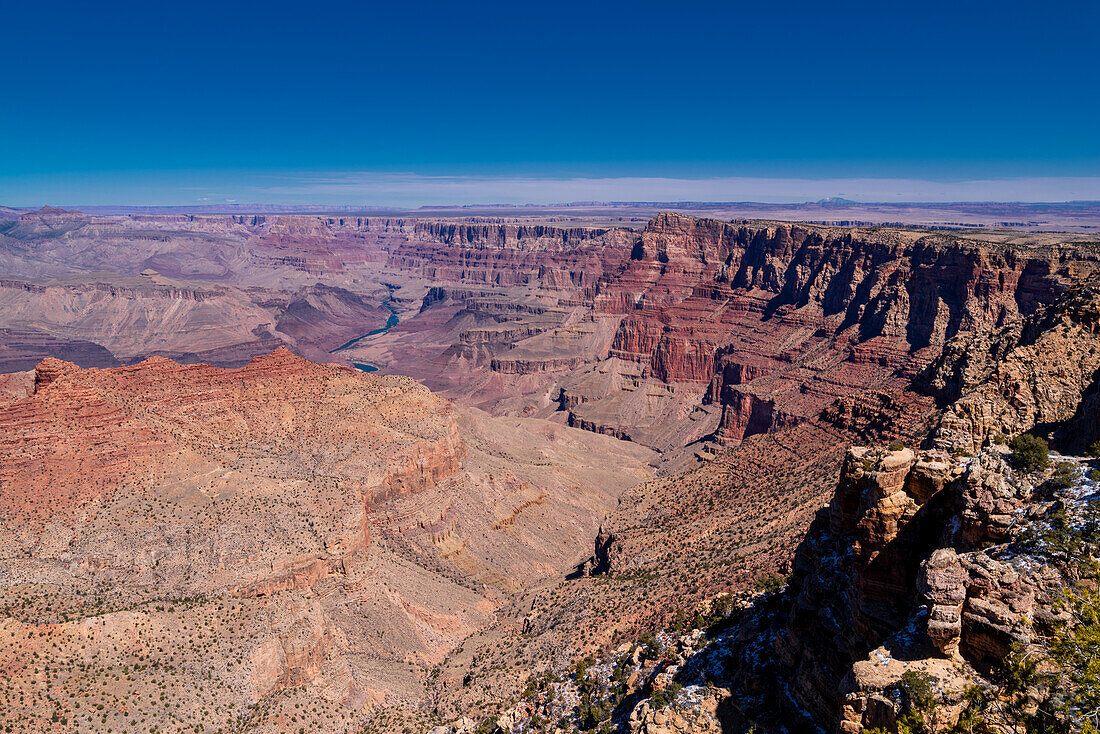 The Grand Canyon as seen from the South Rim in Arizona. The large gorge was eroded over millions of years by weather and the Colorado river that still runs through it. The reddish tint it has is due to the iron contained in the rock's minerals that oxide.