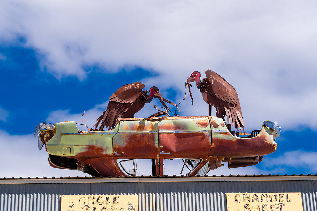 Vulture sculpture made of board metal.