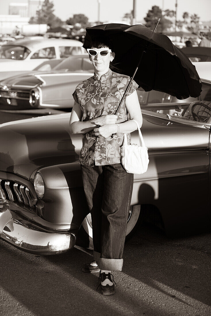 Woman with vintage outfit on a classic car show in Las Vegas