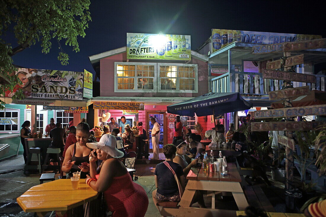 Fish fry are typical restaurants in the Bahamas that offer fish and seafood. You are on Fish Fry Street at Arawak Cay, Nassau, New Providence Island, The Bahamas