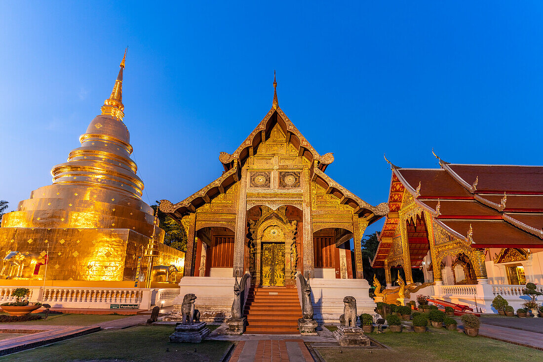 The Buddhist temple complex of Wat Phra Singh at dusk, Chiang Mai, Thailand, Asia