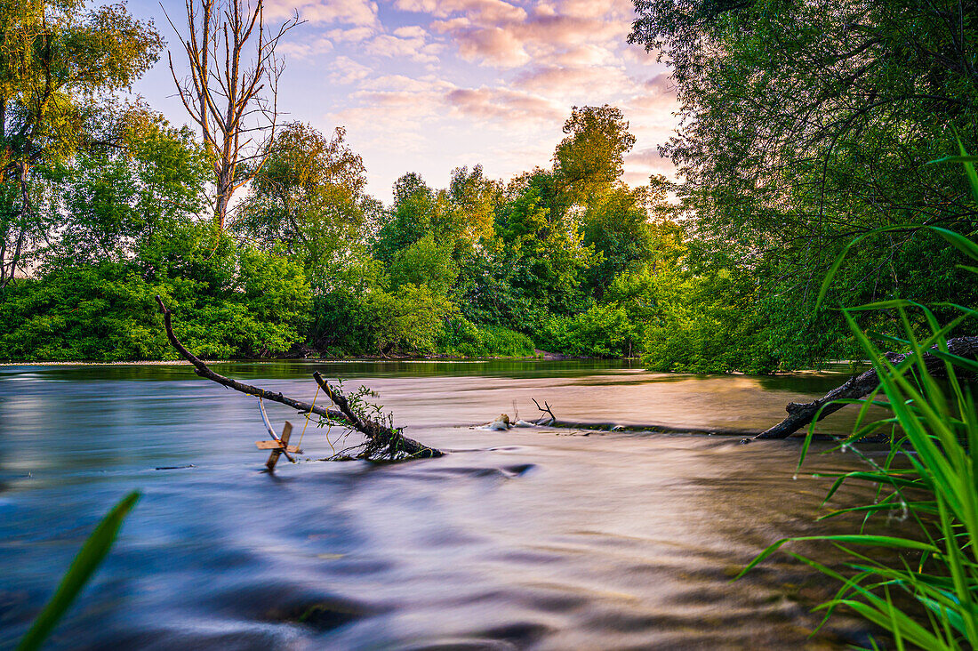 Long exposure on the banks of the river Saale in summer at sunset, Jena, Thuringia, Germany