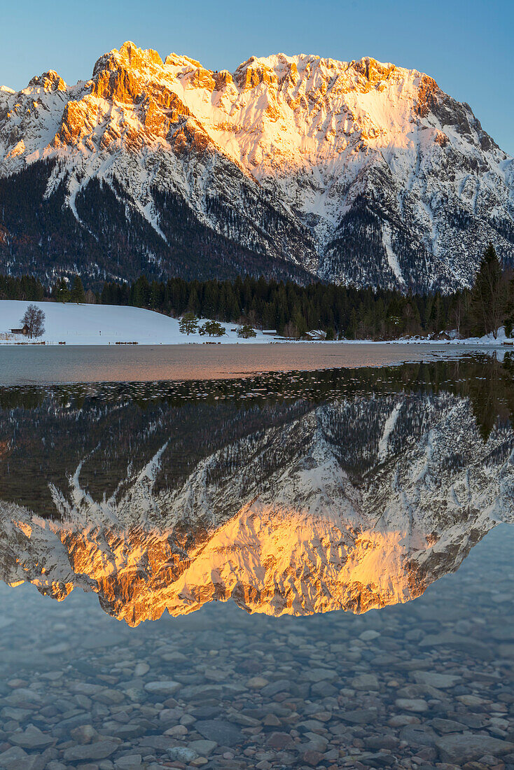 Wintry evening mood at the Schmalensee with a view of the Karwendel mountains, Upper Bavaria, Germany.