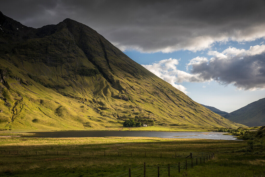 Evening light on Loch Achtriochtan with Aonach Dubh (888m) in Glencoe, Highlands, Scotland, UK