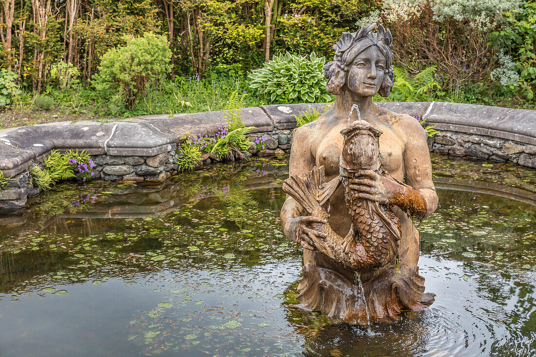 Mermaid fountain in the park by Ardkinglas Woodland House, Cairndow, Argyll and Bute, Scotland, UK