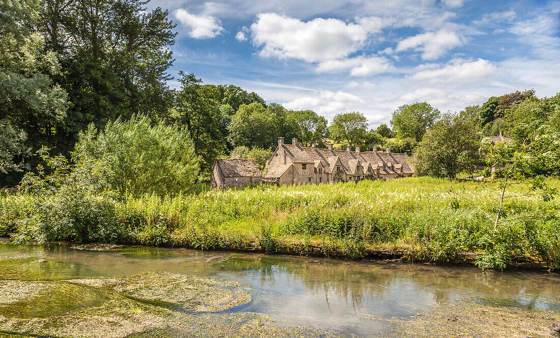 Arlington Row and River Coln in Bibury, Cotswolds, Gloucestershire, England