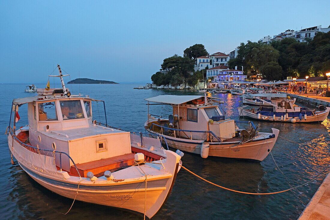 View from the fishing boats at the harbor quay of Skiathos town, Skiathos island, Northern Sporades, Greece