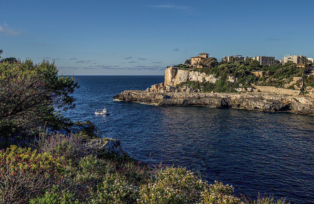 Fishing trawler at the mouth of the rocky bay, seaside villa, Cala Figuera, Mallorca, Spain