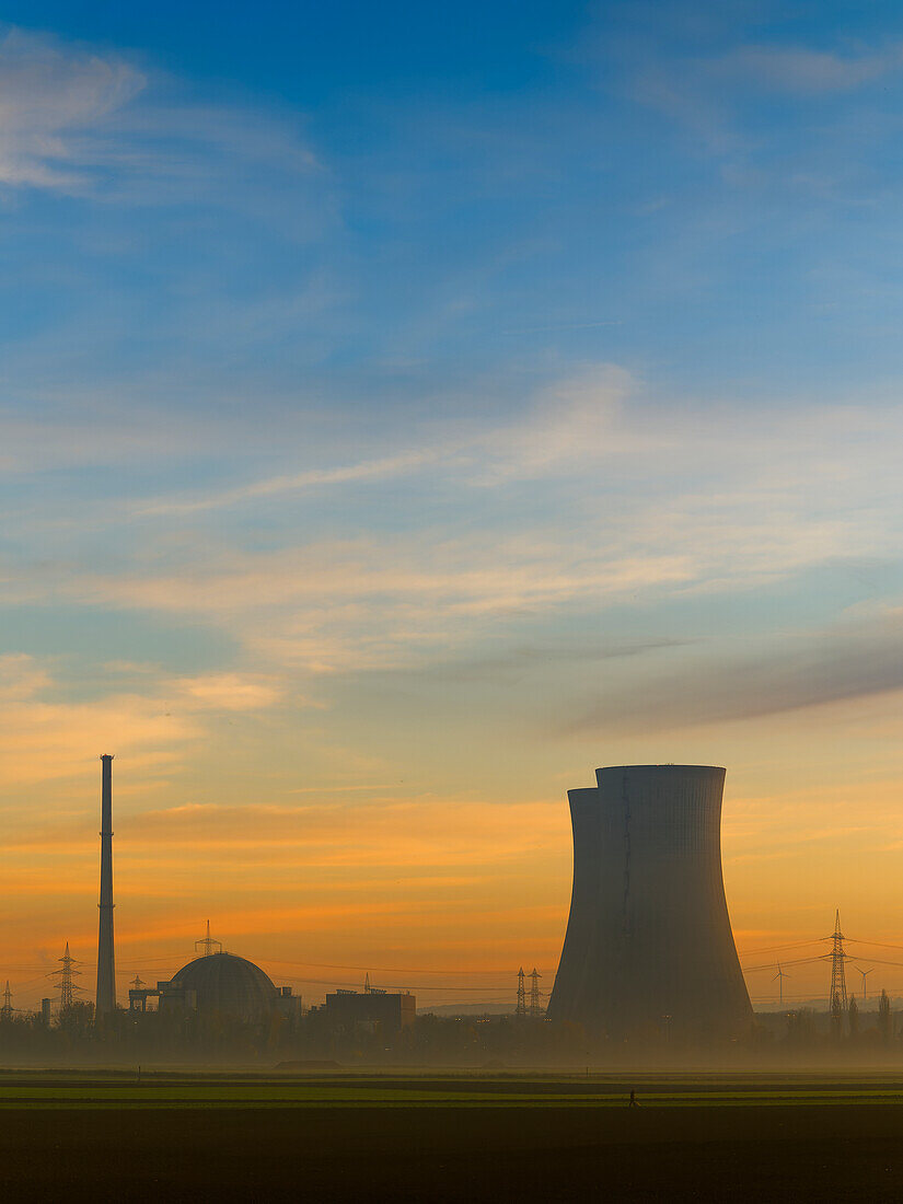 Grafenrheinfeld nuclear power plant in the fog and evening light, Schweinfurt district, Lower Franconia, Franconia Bavaria, Germany