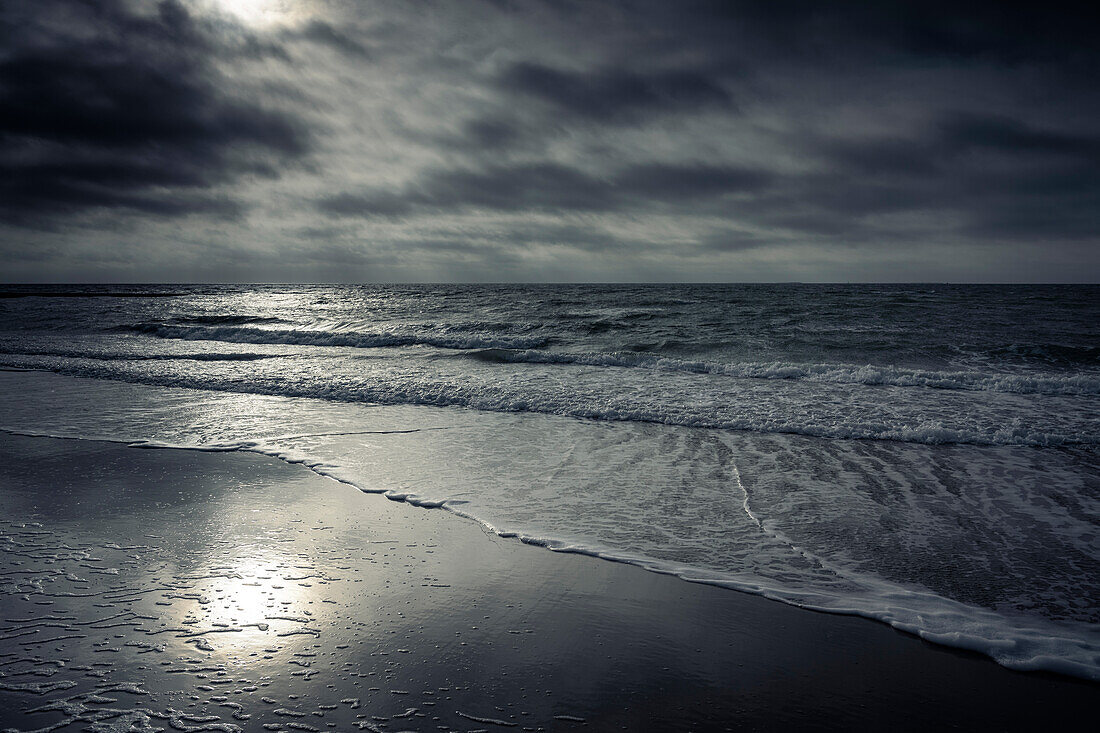 Sandy beach and surf back lit by the sun, Borkum, East Frisian Islands, Lower Saxony, Germany, Europe