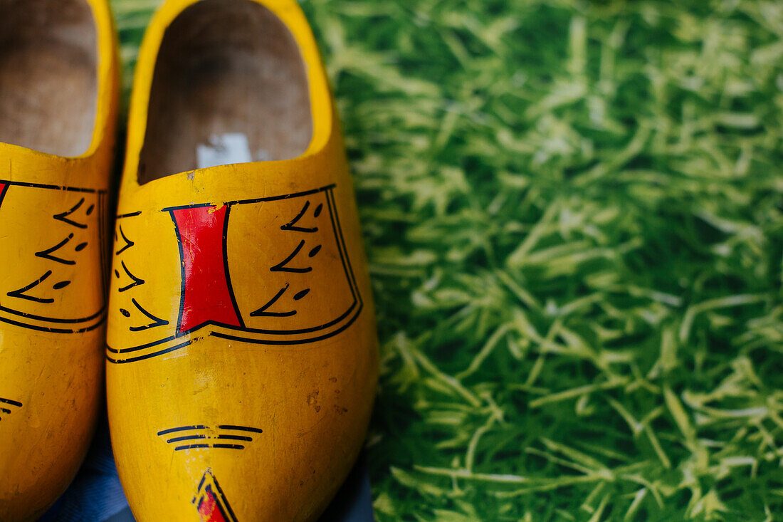 Gouda, The Netherlands, Yellow clogs on display on grass during the cheese marker