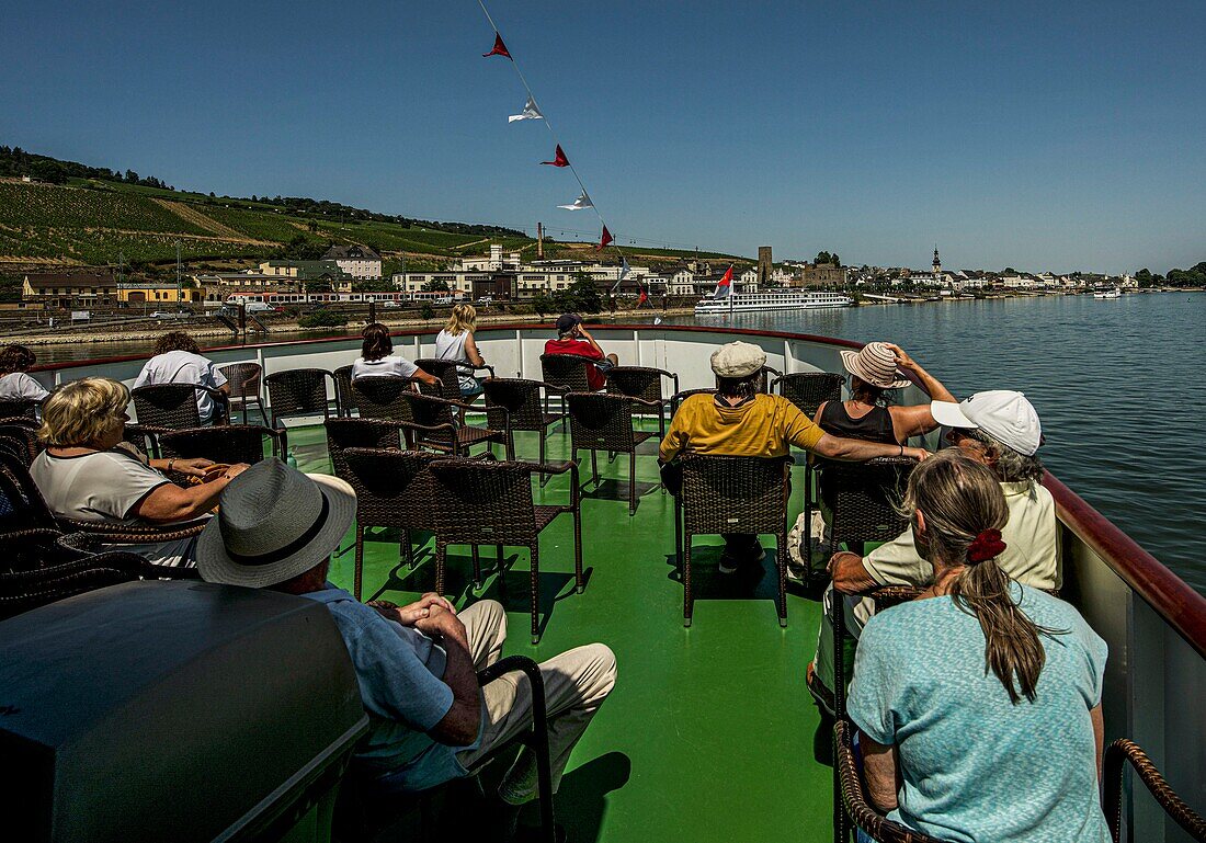 Passengers during a scenic cruise on the Rhine to Ruedesheim, Upper Middle Rhine Valley, Hesse, Germany