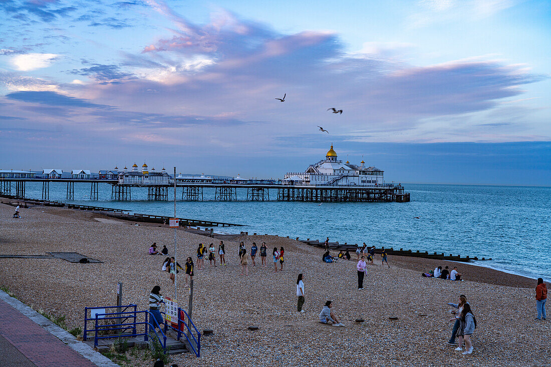 Beach and seaside resort of Eastbourne at dusk, England, UK, Europe