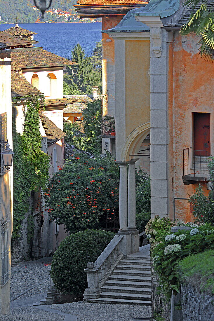 Via Caire Alberoletti with the Church of Santa Maria Assunta in Orta San Giulio, Piedmont, Italy