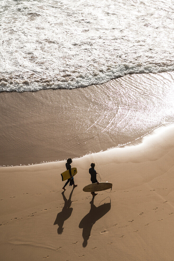 Surfists on the coast, Algarve, Portugal, February 2019