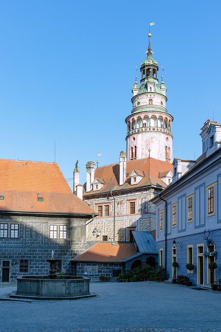 Second courtyard, small castle and castle tower in Český Krumlov in South Bohemia in the Czech Republic