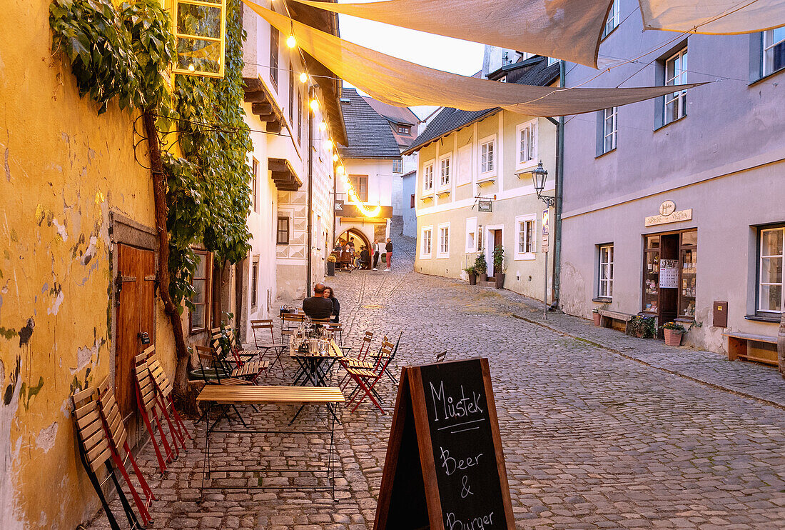 Old town alley Masná with restaurants in Český Krumlov in Southern Bohemia in the Czech Republic