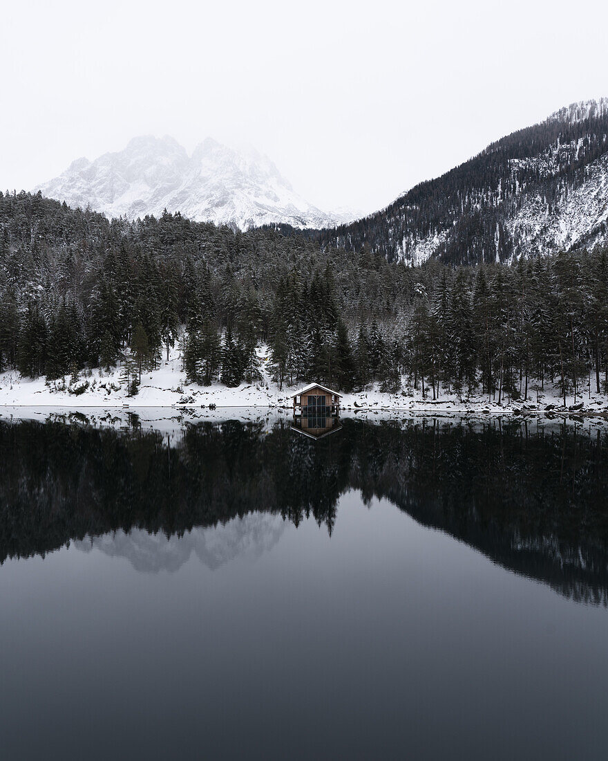 Boat hut reflected in Mittersee, Biberwier, Austria