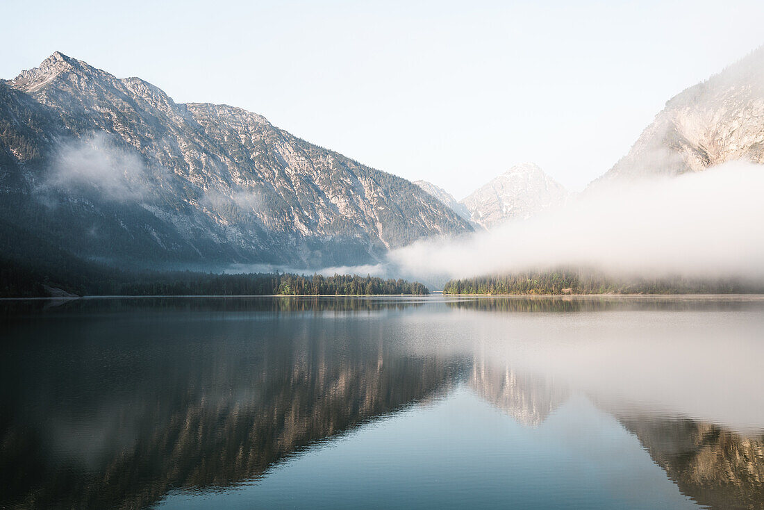 Foggy morning atmosphere at Plansee, Reutte, Austria