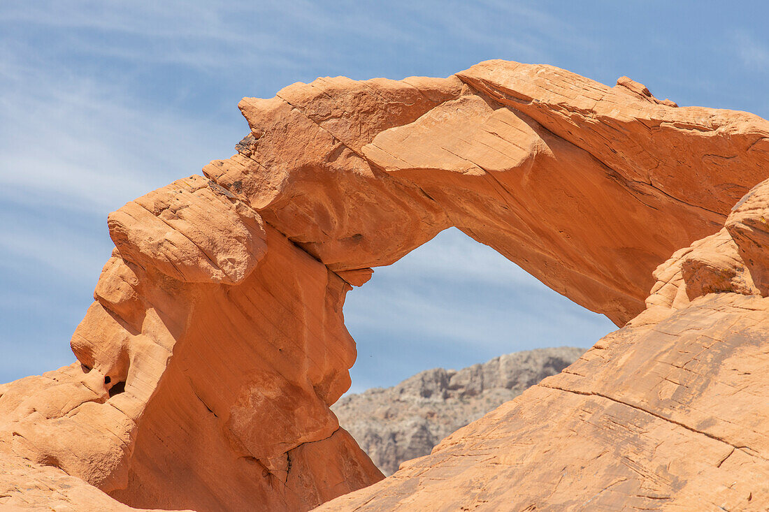 View of a mountain through Atlatl Rock arch in the Valley of Fire.