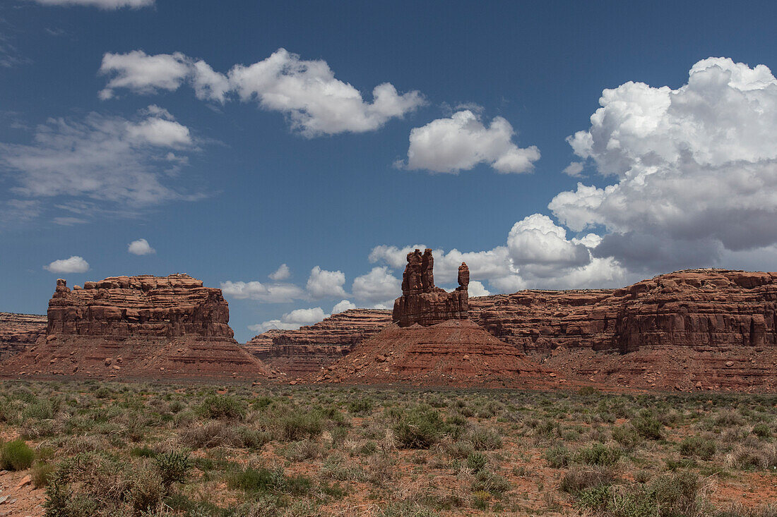 Fingers of rock against a blue sky in Monument Valley, Utah.