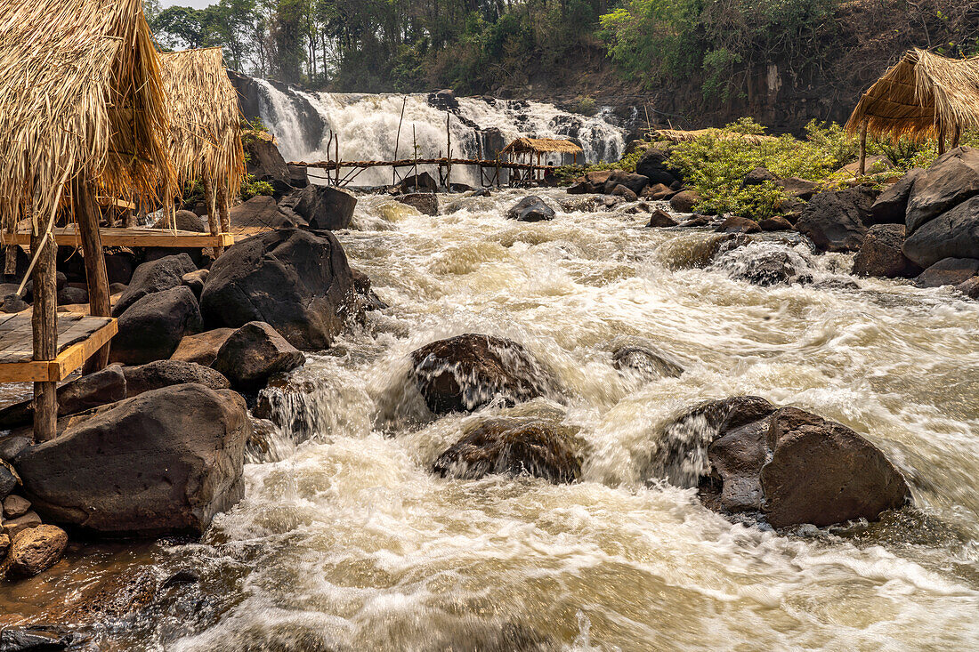 Huts at Tad Lo waterfall in the Bolaven Plateau near Ban Saenvang, Laos, Asia