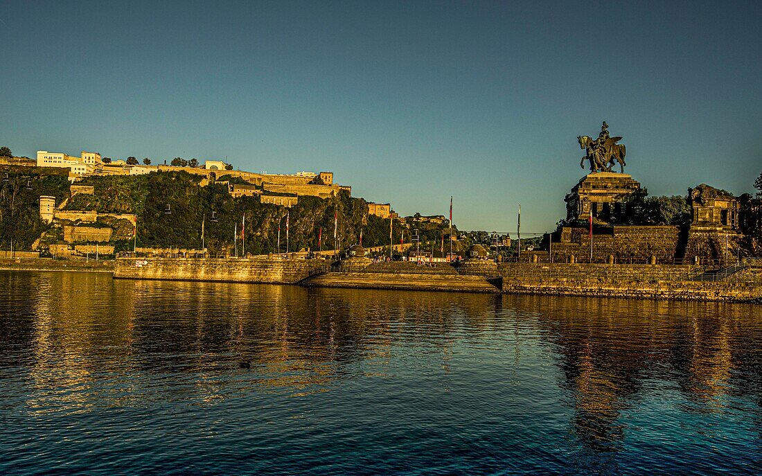 Imperial monument at Deutsches Eck in the evening light, in the background the Ehrenbreitstein Fortress, Koblenz, Upper Middle Rhine Valley, Rhineland-Palatinate, Germany