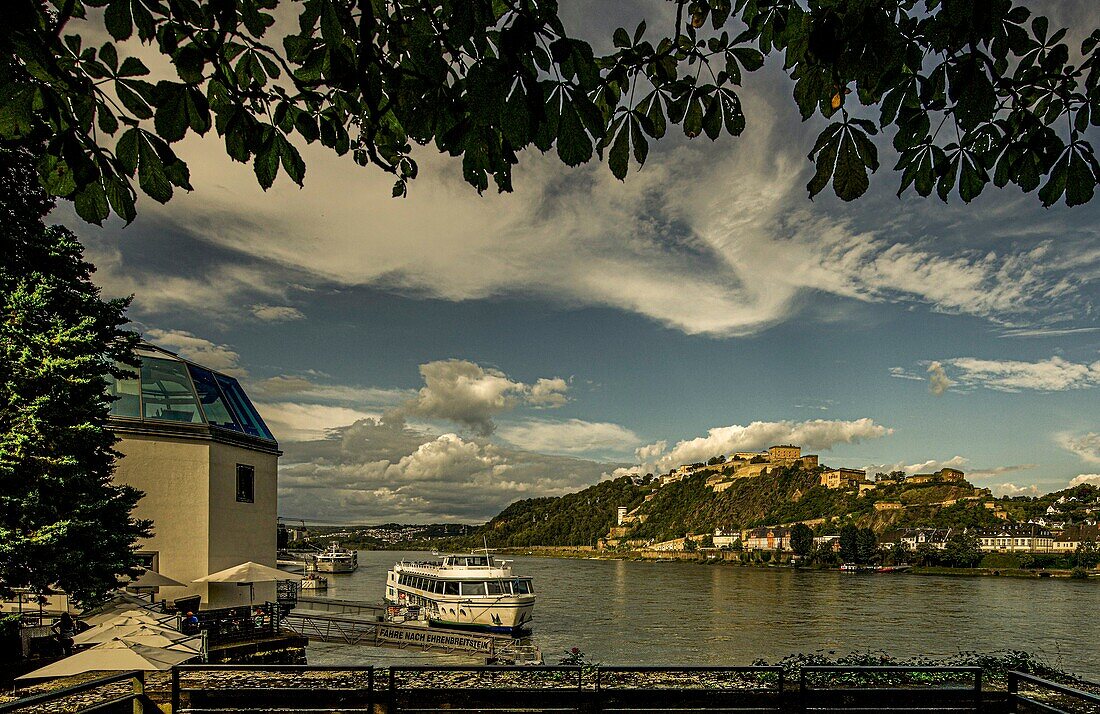 View from the Rhine promenade in Koblenz over the Rhine to excursion boats and the Ehrenbreitstein Fortress, on the left the Pegelhaus, Upper Middle Rhine Valley, Rhineland-Palatinate, Germany