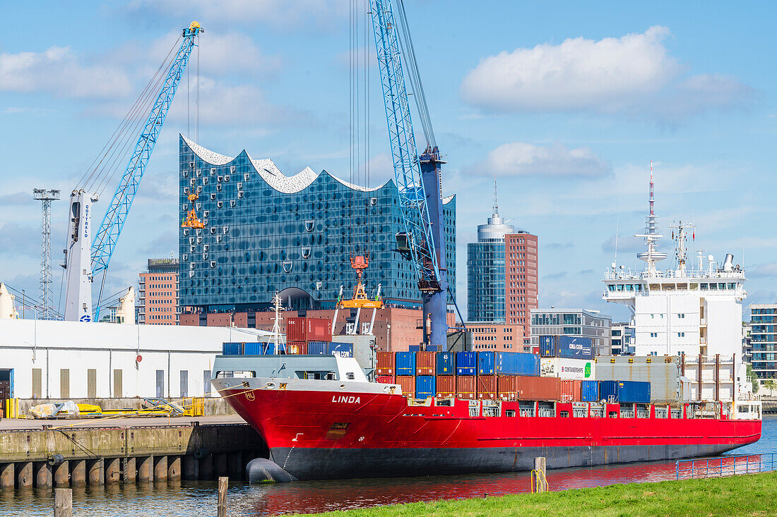 Elbphilharmonie concert hall, harbor with container ship, Hafencity, Hamburg, Germany